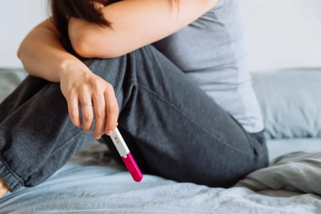 Woman checking pregnancy test result — Female Infertility Treatment in Pune